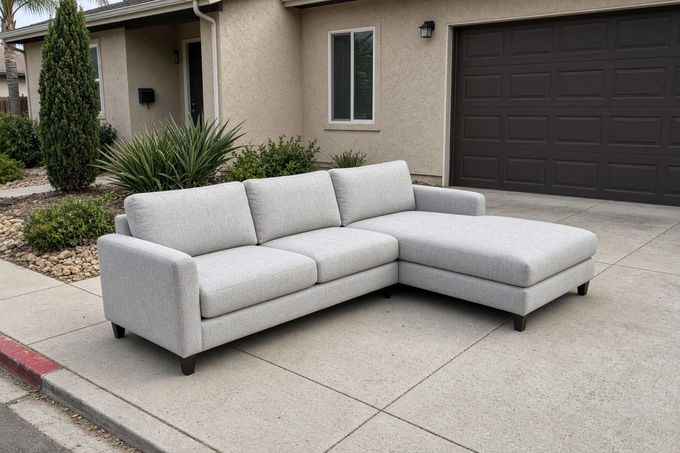 Chaise sofa on a San Diego driveway ready for sofa chaise removal