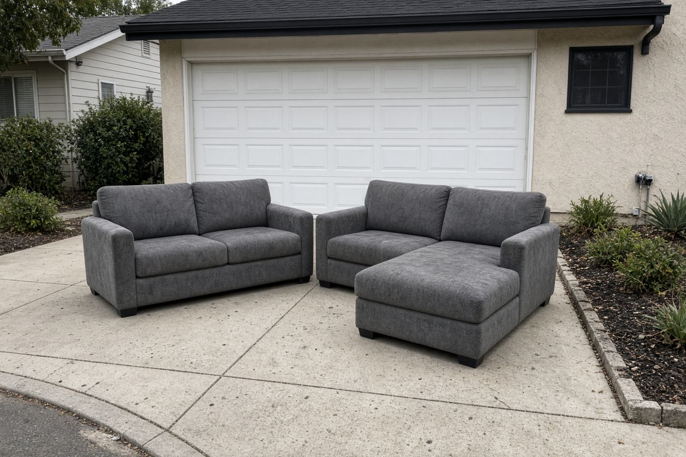 Two-piece sectional sofa on a San Diego driveway ready for sectional removal