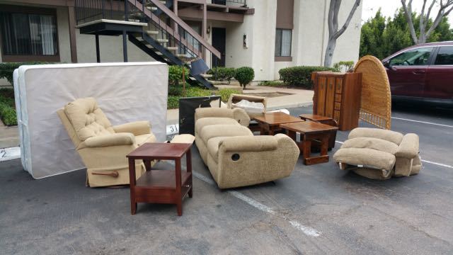 Living-room furniture stacked as a half truck load for San Diego junk removal